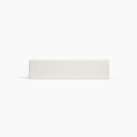 Avec linen classic top sheet in bone folded neatly on a white background