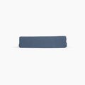Avec linen fitted sheet in harbor folded neatly on a white background