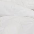 A detailed view of the Slumber Cloud Comforter fabric with temperature regulating technology