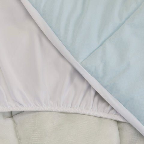 A close up shot of the Slumber Cloud Essential Mattress Pad made with Outlast temperature regulation technology.