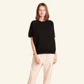 Woman wearing the Slumber Cloud Essential Raglan Pullover made with Outlast temperature regulation technology