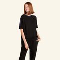 Woman wearing the Slumber Cloud Essential Raglan Pullover made with Outlast temperature regulation technology