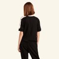 Woman wearing the Slumber Cloud Essential Raglan Pullover made with Outlast temperature regulation technology