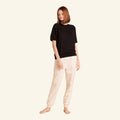 Woman wearing the Slumber Cloud Essential Raglan Pullover made with Outlast temperature regulation technology