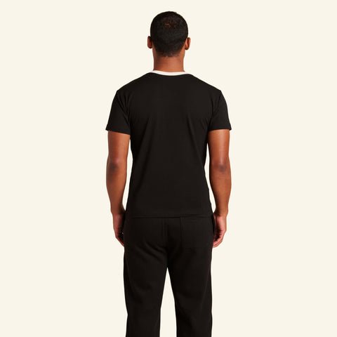 Man wearing the Slumber Cloud Essential V-Neck made with Outlast temperature regulation technology