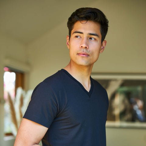Man wearing the Slumber Cloud Essential V-Neck made with Outlast temperature regulation technology